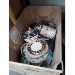 A box of plates and other pottery