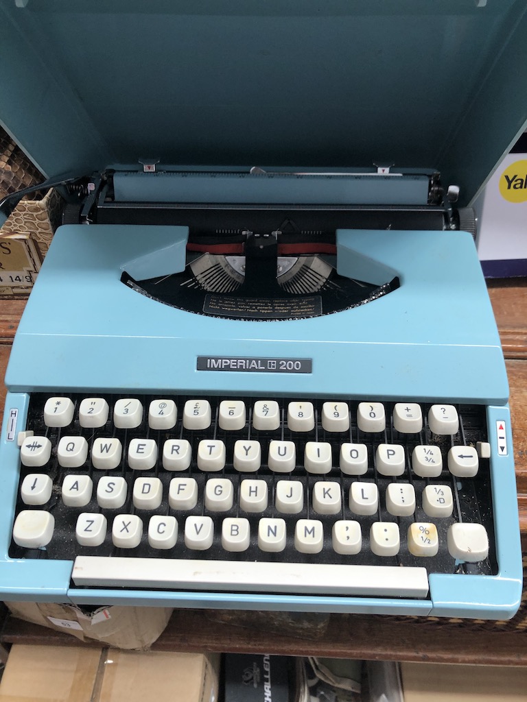 A vintage blue Imperial 200 typewriter