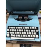 A vintage blue Imperial 200 typewriter