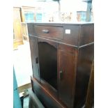 A small oak sewing machine cabinet/kneehole desk conversion.