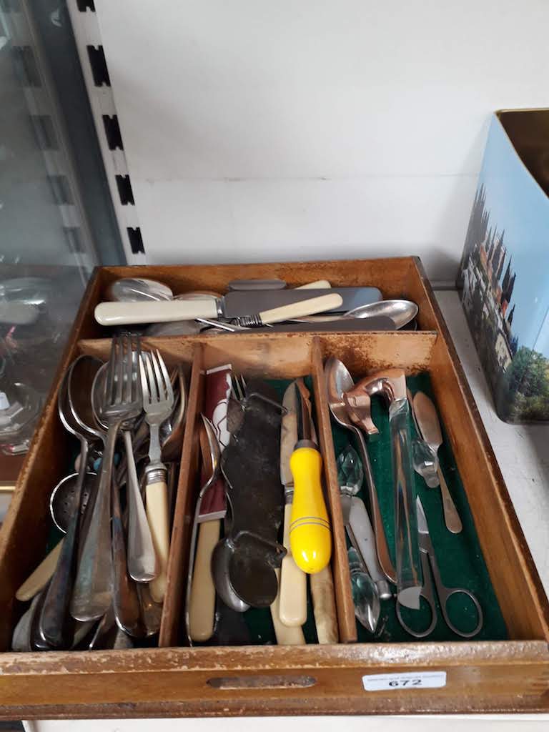 Wooden tray of cutlery