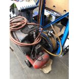 An Airstream compressor and a reel of high pressure hose