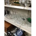 A selection of cut and other glass including two decanters.