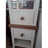A pair of cream modern bedside cabinets and another reproduction mahogany bedside