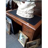 An early 20th century oak and burr wood pedestal desk