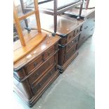 A pair of reproduction bedside chests of drawers.