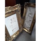 Two reproduction classical style relief plaques in ornate frames.