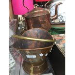 A copper kettle and a copper and brass coal scuttle