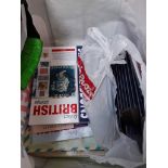 A bag of stamp reference books and empty Sandhill coin folders