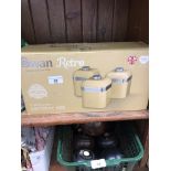 A boxed Swan Retro 3 piece cream canister set.