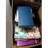 A box of stamp albums and first day covers