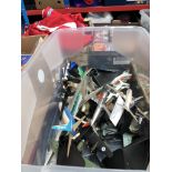 A crate of unboxed model aircraft