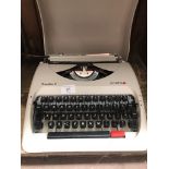 A Olympia Traveller C typewriter.