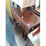 A twist oak gate leg table