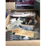 A box of model railway accessories