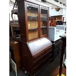 A mahogany bureau bookcase