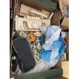 A box of sewing machine attachmements