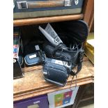 A JVC GR-D23EK video camera, a Kodak Advantix F300 camera and a Kodak Easyshare M753 digital camera.