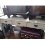 A modern 3 drawer console table