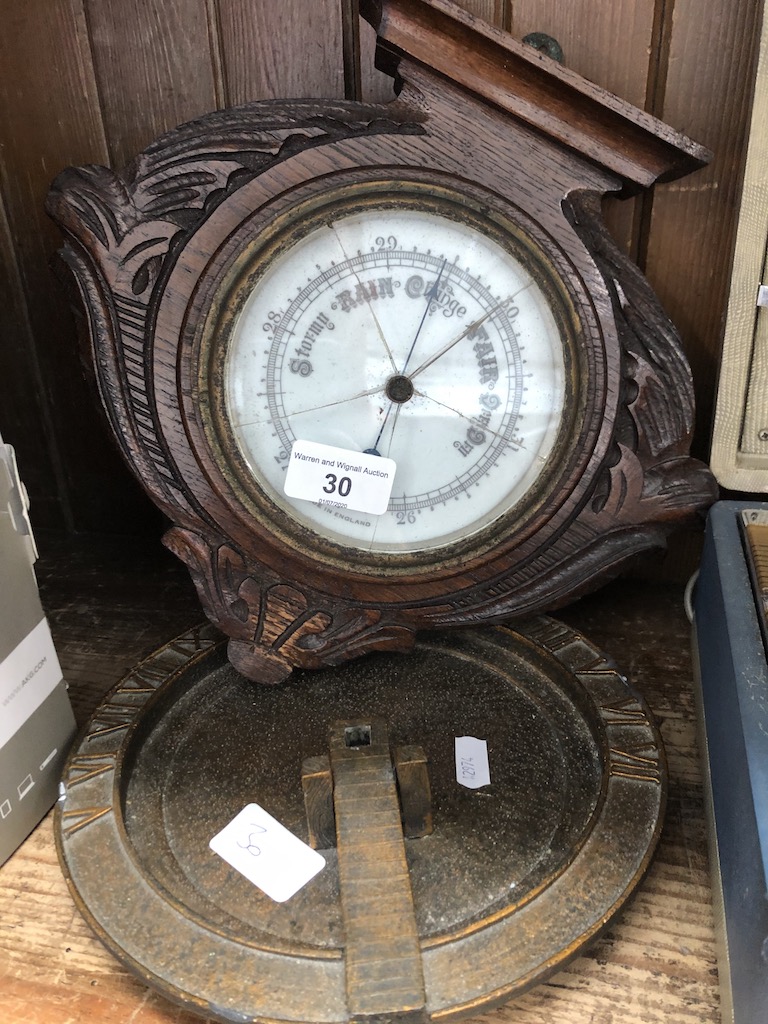 A repro sundial and a wall hanging barometer