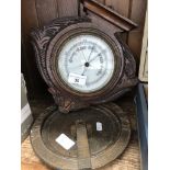 A repro sundial and a wall hanging barometer