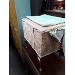 A cabriole leg upholstered sewing box