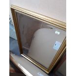 A large gilt framed bevelled edge mirror