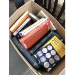 A box of coin, stamp and medal reference books