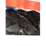 A box with motorcycle leathers etc