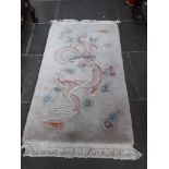 A Chinese rug 162cm x 91cm.