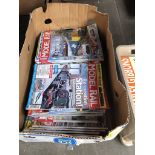 A box of model rail magazines.