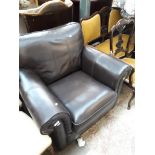 A brown faux leather armchair