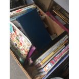 A box of stamp albums and first day covers