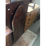 A hardwood rustic style cupboard with large metal bound hinges