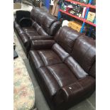 A two piece brown faux leather suite