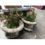 Two large concrete planters and bases
