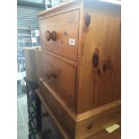 A pine two drawer bedside cabinet