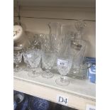 A collection of Cumbria crystal, a Babycham glass, a cut glass decanter, a jug and some other
