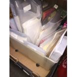 A box of envelopes and notepads.