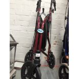A red mobility walking aid