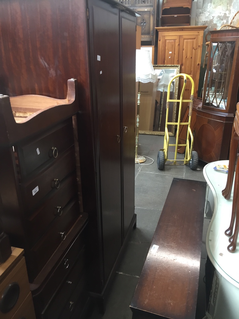 A pair of Stag chest of drawers and matching wardrobe.