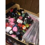 A box containing large quantity of nail varnish, lacquers and L`Action face masks.