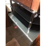 A glass coffee table and a glass tv stand