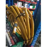 A coil of yellow garden hose