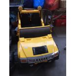 A yellow Force 4X4 jeep with battery and charger.