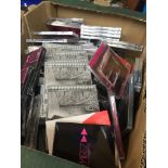 A box of sealed CDs