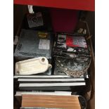 A box of misc, books, car radio's, POlaroid camera, TV wall bracket etc