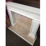 A white and marble effect fire place