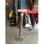 A garden fork and a garden rake