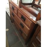 A pine chest of drawers with aesthetic handles